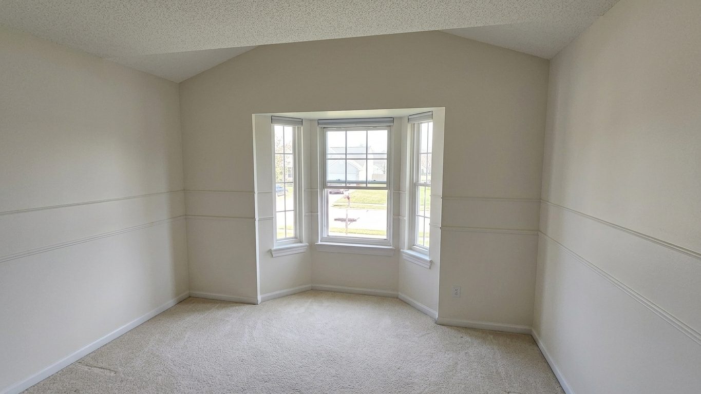 A bay-window bedroom with freshly painted walls and ceiling — Home Strategy LLC, Michigan